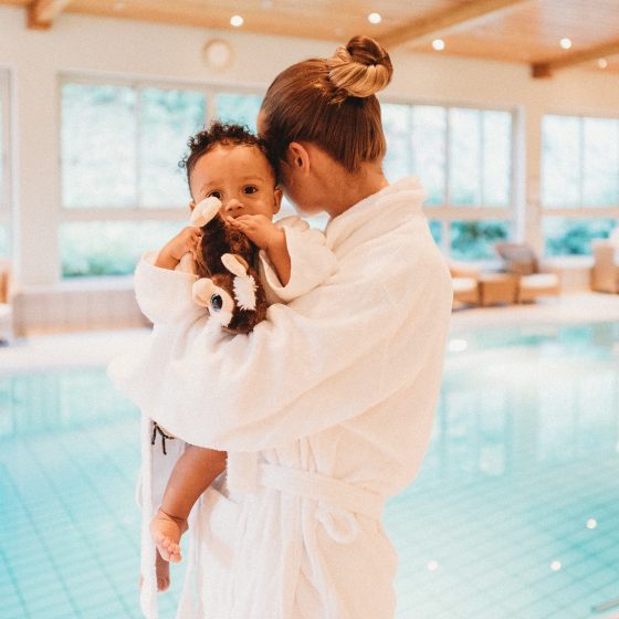 Woman in spa with baby
