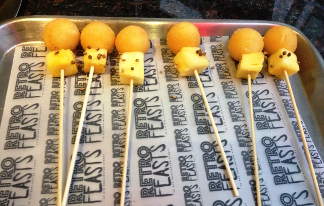Cheese and pineapple on sticks