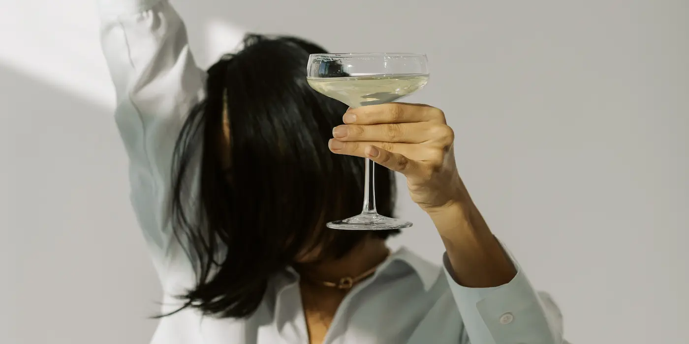 New Year resolutions, woman with martini glass