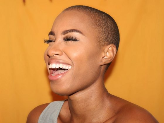 Smiling bald headed woman